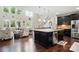 Open-concept kitchen with an island, stainless steel appliances, and views into the living area at 161 Leaning Tower Dr, Mooresville, NC 28117