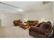 Large living room with plush brown sofas, decorative pillows and lamps, and neutral carpet at 161 Leaning Tower Dr, Mooresville, NC 28117