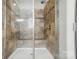 Modern tiled shower with built-in seating and sleek glass doors for a spa-like experience at 161 Leaning Tower Dr, Mooresville, NC 28117