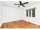 Bright bedroom boasts hardwood floors and a large window, offering ample natural light at 1809 Jameston Dr, Charlotte, NC 28209