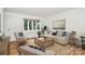 Bright living room with hardwood floors, neutral walls, and comfortable seating at 1809 Jameston Dr, Charlotte, NC 28209