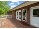 A backyard deck is accessible through glass paneled doors and provides outdoor relaxation at 2016 Townview Dr, Kannapolis, NC 28081