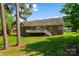Well-maintained backyard with a deck, brick house, and plenty of green space at 2016 Townview Dr, Kannapolis, NC 28081
