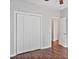 Bedroom featuring hardwood floors, neutral paint, and ample closet space at 2016 Townview Dr, Kannapolis, NC 28081