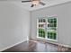 Bright bedroom featuring hardwood floors, neutral paint, and a large window at 2016 Townview Dr, Kannapolis, NC 28081