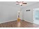 Bedroom featuring hardwood floors, neutral paint, a ceiling fan, and attached bathroom at 2016 Townview Dr, Kannapolis, NC 28081