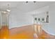 Open-concept living area with beautiful wood floors, leading to a breakfast bar and French doors at 2016 Townview Dr, Kannapolis, NC 28081