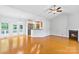 Spacious living room with hardwood floors, fireplace, and French doors to the outside at 2016 Townview Dr, Kannapolis, NC 28081