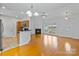 Bright living room featuring wood floors, fireplace, and open access to the kitchen, ideal for entertaining at 2016 Townview Dr, Kannapolis, NC 28081