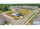 Aerial view of a neighborhood with a community pool, common area, and modern townhomes at 3119 Beacon Heights Rd, Indian Land, SC 29707