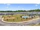 Aerial view of a modern community with a pool, amenity center, and townhomes in a planned neighborhood at 3119 Beacon Heights Rd, Indian Land, SC 29707