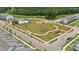 Aerial view showcasing a new neighborhood with a community pool and amenity center surrounded by green space at 3119 Beacon Heights Rd, Indian Land, SC 29707