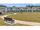Bench overlooking grassy community space in front of townhomes at 3125 Beacon Heights Rd, Indian Land, SC 29707