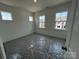 Well-lit bedroom with multiple windows offering a view of the neighborhood at 3127 Beacon Heights Rd, Indian Land, SC 29707