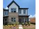 Charming two-story townhome featuring a mix of brick and siding, complemented by professionally landscaped yard at 3127 Beacon Heights Rd, Indian Land, SC 29707