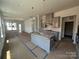 Spacious eat-in kitchen with a kitchen island, gray cabinets and stainless appliances at 3127 Beacon Heights Rd, Indian Land, SC 29707