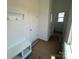Functional mudroom area with storage and access to a half bath at 3127 Beacon Heights Rd, Indian Land, SC 29707