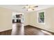 Bright dining room showcasing sleek, dark laminate flooring and an open view into the renovated kitchen at 315 Rivers St, Rock Hill, SC 29730