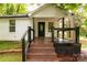 Inviting front porch with wooden steps, dark railings, and house number display at 315 Rivers St, Rock Hill, SC 29730