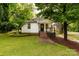 Charming single-story home featuring a cozy front porch and a well-maintained, tree-lined yard at 315 Rivers St, Rock Hill, SC 29730