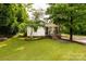 Charming curb appeal with a well-maintained lawn and mature trees surrounding the property at 315 Rivers St, Rock Hill, SC 29730
