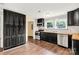 Renovated kitchen featuring sleek, dark cabinetry, butcher block countertops, and stainless steel appliances at 315 Rivers St, Rock Hill, SC 29730