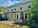 Outdoor patio area features a grill, outdoor seating, and partially shaded by large trees at 3678 Privette Rd # 349, Matthews, NC 28104