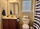 Half bathroom with modern fixtures and blue-striped shower curtain at 3678 Privette Rd # 349, Matthews, NC 28104