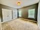 This empty bedroom features neutral walls and carpet, and two large windows with bright natural light at 3678 Privette Rd # 349, Matthews, NC 28104