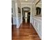 Entryway with hardwood floors, wainscoting, arched doorway, and decorative mirror at 3678 Privette Rd # 349, Matthews, NC 28104