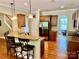 Kitchen with granite countertops, stainless steel appliances, and breakfast bar at 3678 Privette Rd # 349, Matthews, NC 28104