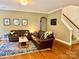 The living room showcases hardwood floors, a brown leather couch, and a decorative rug at 3678 Privette Rd # 349, Matthews, NC 28104