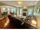 This open-concept living room features hardwood floors, a fireplace, and views into the kitchen and dining areas at 3678 Privette Rd # 349, Matthews, NC 28104