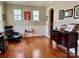 Bright living room featuring hardwood floors, wainscoting, windows, and elegant decor at 3678 Privette Rd # 349, Matthews, NC 28104