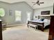 Spacious main bedroom features vaulted ceiling, neutral paint, and natural light from the windows and glass door at 3678 Privette Rd # 349, Matthews, NC 28104