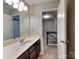 Bathroom featuring a large vanity with a mirror and doorway at 3711 Green Pasture Rd, Charlotte, NC 28269