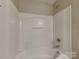 The bright bathroom features a clean white shower and tub at 3711 Green Pasture Rd, Charlotte, NC 28269