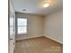 Bright bedroom with neutral walls and carpet flooring, illuminated by natural light at 3711 Green Pasture Rd, Charlotte, NC 28269