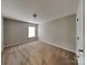 This bedroom features neutral walls, carpet flooring, and a bright window at 3711 Green Pasture Rd, Charlotte, NC 28269