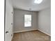 This bedroom features neutral walls, carpet flooring, and a bright window at 3711 Green Pasture Rd, Charlotte, NC 28269