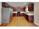 Kitchen featuring stainless steel appliances, dark cabinets, and tile backsplash at 3711 Green Pasture Rd, Charlotte, NC 28269