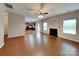 Living area with fireplace, hardwood floors, and an open view into the kitchen at 3711 Green Pasture Rd, Charlotte, NC 28269