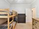 Comfortable bedroom with bunk beds, dresser, carpet flooring, and natural light at 3801 Creek Ridge Dr, Denver, NC 28037
