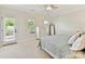 Cozy bedroom featuring carpet, natural light, and a private door to the exterior at 3801 Creek Ridge Dr, Denver, NC 28037
