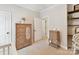 Bright bedroom with wicker furniture, neutral carpet, and ample natural light at 3801 Creek Ridge Dr, Denver, NC 28037