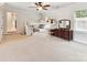 Expansive bonus room with bunk beds, carpet flooring, ceiling fan, and natural light at 3801 Creek Ridge Dr, Denver, NC 28037