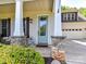 Charming front entrance with a decorative glass door and stone-accented columns at 3801 Creek Ridge Dr, Denver, NC 28037