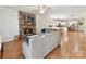 Cozy living room with a stone fireplace and open floor plan into the kitchen at 3801 Creek Ridge Dr, Denver, NC 28037