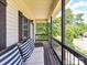 Inviting front porch with comfortable seating, perfect for relaxing and enjoying the outdoors at 3801 Creek Ridge Dr, Denver, NC 28037