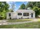 Charming one-story home with black shutters, a gray roof, and a well-manicured front yard at 3920 Admiral Ave, Charlotte, NC 28205